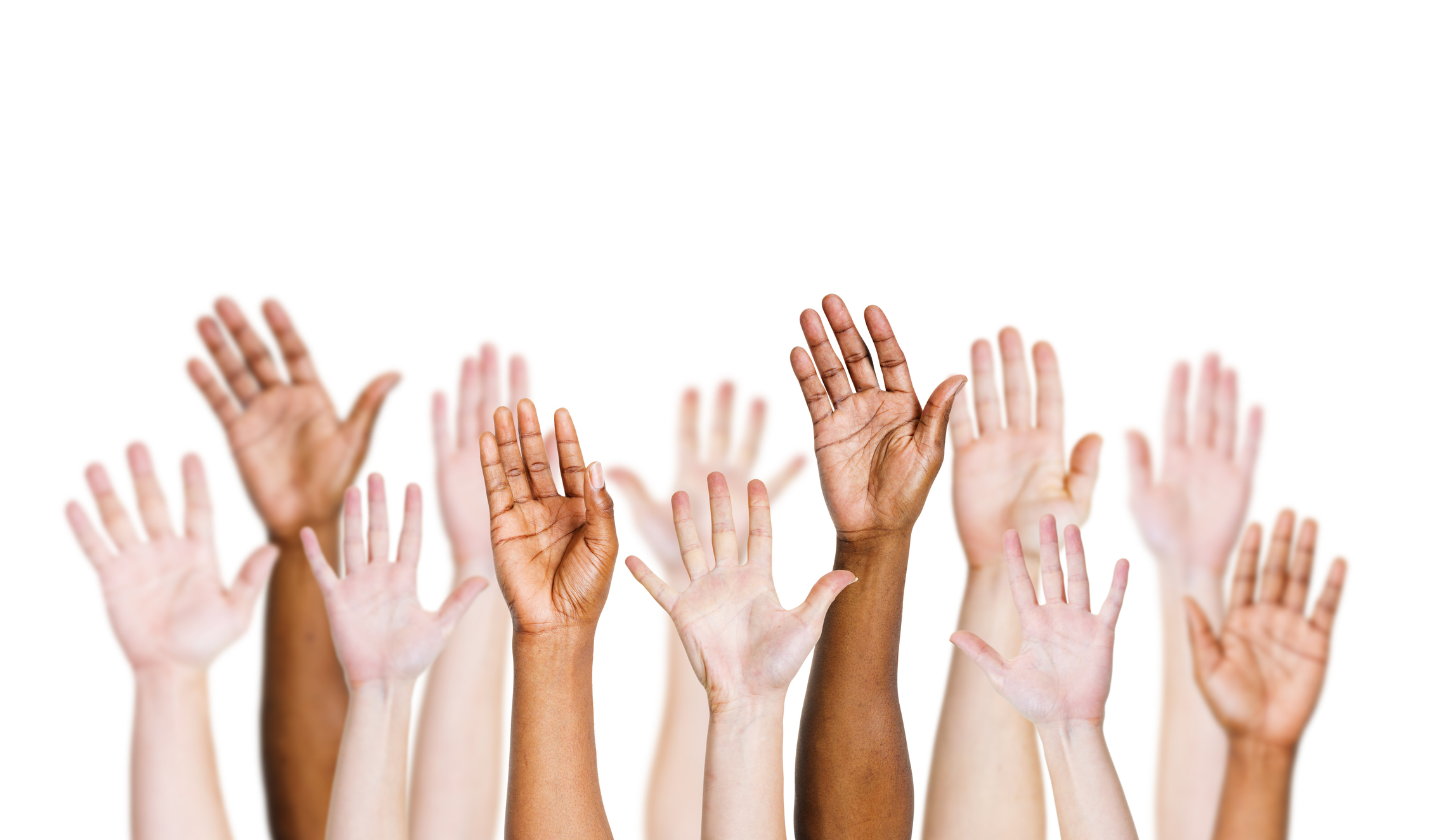Arms with different skin tones raised up over white backdrop